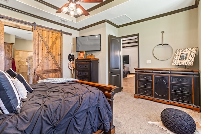 bedroom featuring ceiling fan, carpet flooring, a barn door, and ornamental molding