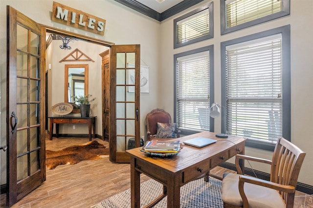 office area featuring hardwood / wood-style flooring, plenty of natural light, french doors, and crown molding