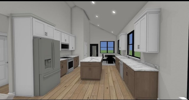 kitchen with white cabinets, high vaulted ceiling, a center island, and stainless steel appliances