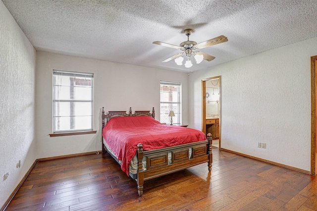 bedroom with hardwood / wood-style floors, connected bathroom, ceiling fan, and a textured ceiling