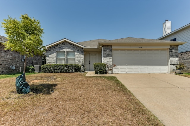 ranch-style house featuring central AC unit, a front yard, and a garage