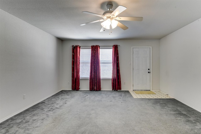 carpeted empty room with ceiling fan