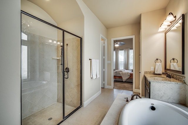 bathroom with tile patterned floors, vanity, and walk in shower