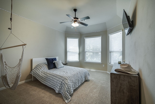 carpeted bedroom featuring ceiling fan and lofted ceiling