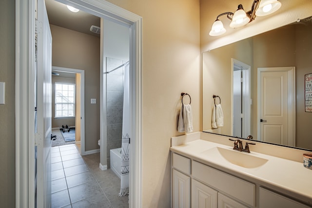 bathroom with shower / tub combination, tile patterned flooring, and vanity