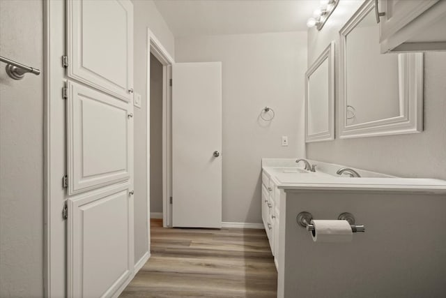 bathroom featuring vanity and hardwood / wood-style floors