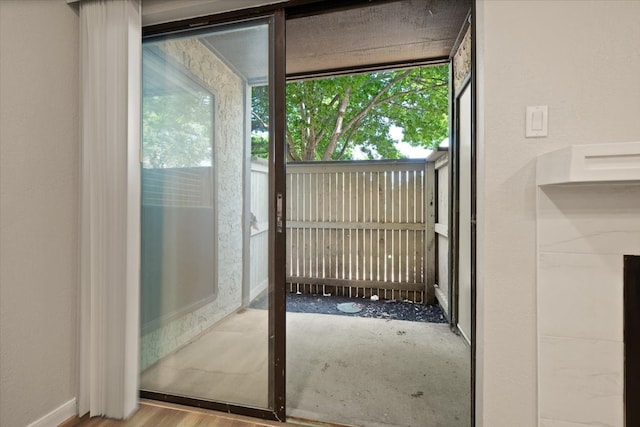 entryway with hardwood / wood-style flooring