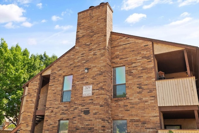 view of home's exterior featuring a balcony