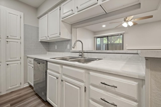 kitchen with dishwasher, decorative backsplash, white cabinetry, dark wood-type flooring, and ceiling fan