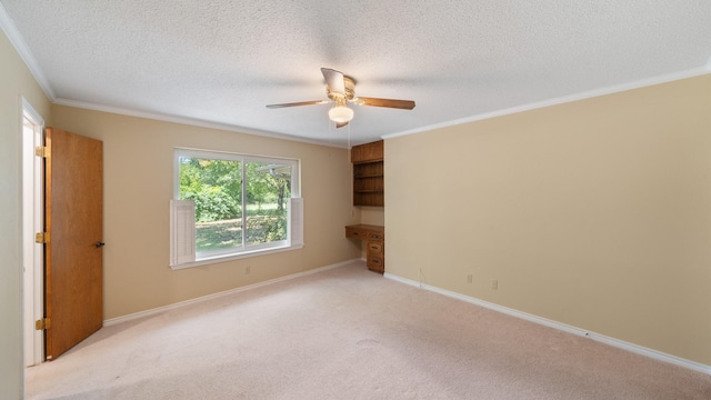 unfurnished room featuring ornamental molding, light carpet, and baseboards