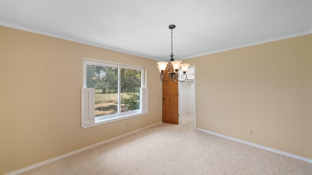 carpeted spare room with crown molding, a notable chandelier, and baseboards