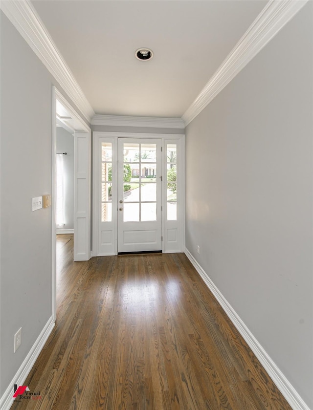 doorway featuring dark wood-style floors, crown molding, and baseboards