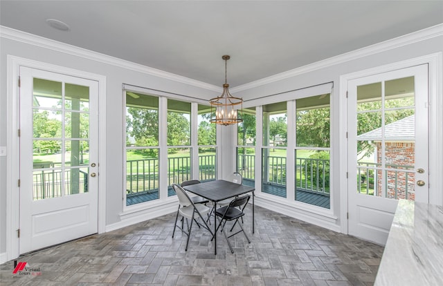 sunroom with an inviting chandelier and plenty of natural light