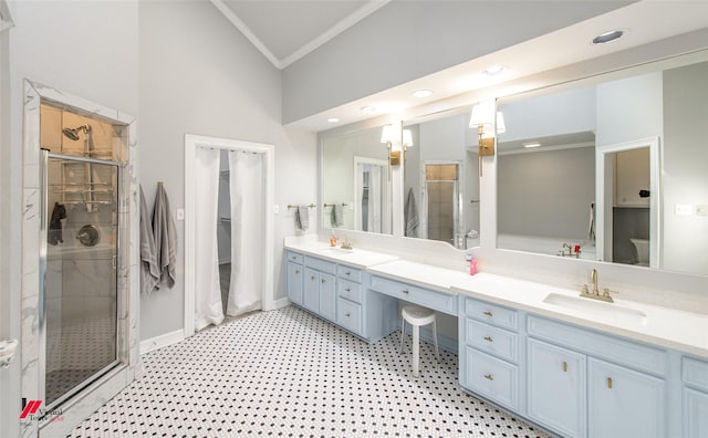 full bath featuring a sink, baseboards, a shower stall, double vanity, and crown molding