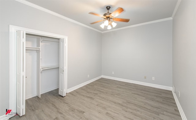 unfurnished bedroom with ceiling fan, ornamental molding, wood finished floors, and baseboards