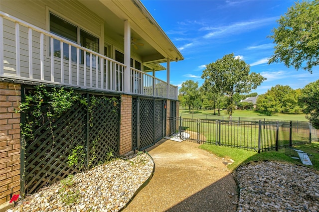 view of side of home with a lawn