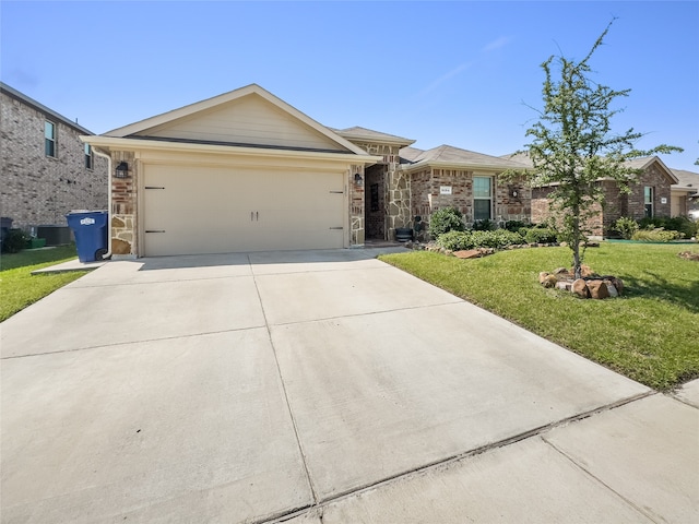 ranch-style home featuring a garage and a front yard