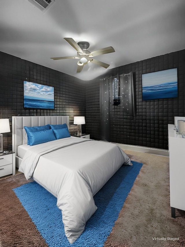 bedroom with carpet floors, visible vents, and a ceiling fan