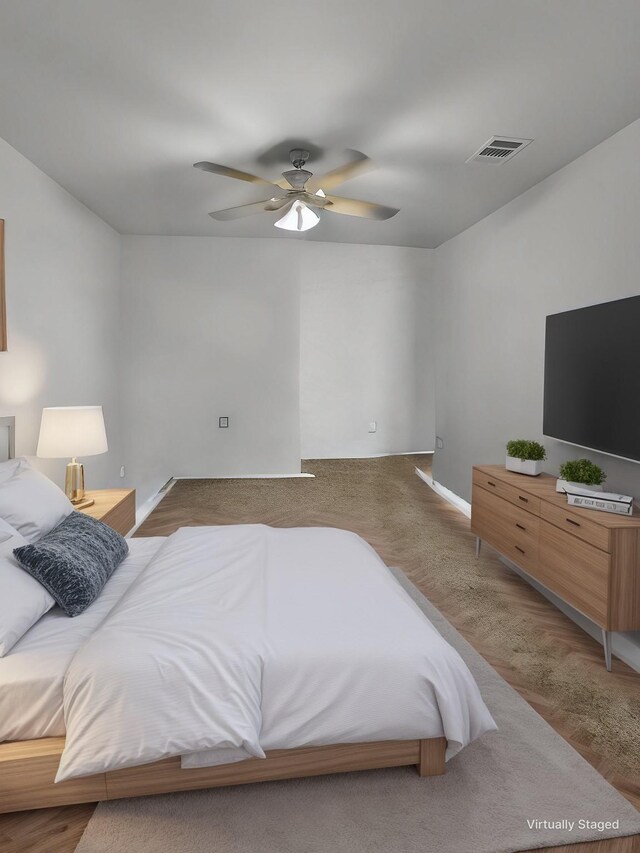 bedroom featuring a ceiling fan and visible vents