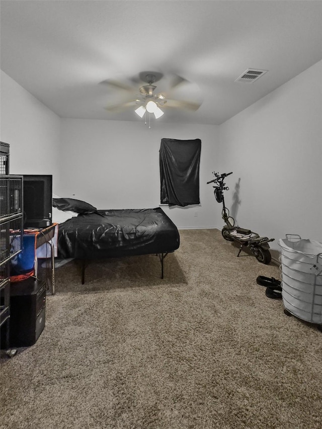 carpeted bedroom with a ceiling fan and visible vents