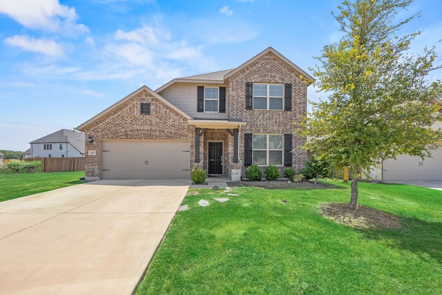 view of front of property featuring a front lawn and a garage