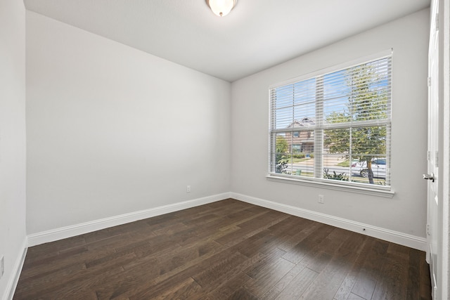 spare room featuring dark hardwood / wood-style floors