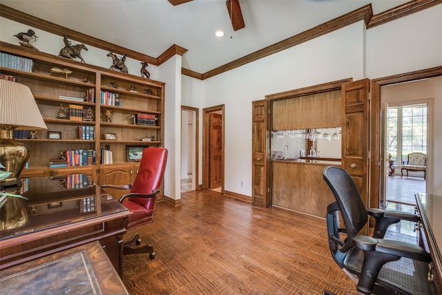 office space featuring crown molding, ceiling fan, and wood-type flooring