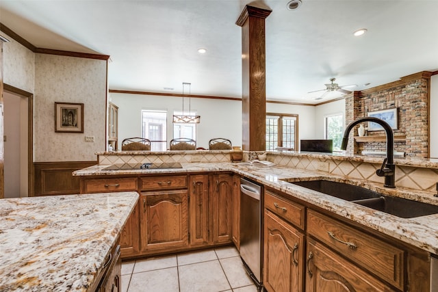 kitchen with ceiling fan, dishwasher, sink, light stone counters, and pendant lighting