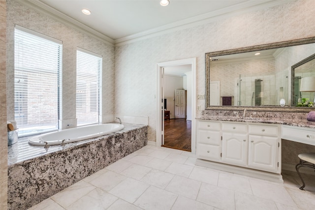 bathroom with a wealth of natural light, crown molding, vanity, and plus walk in shower