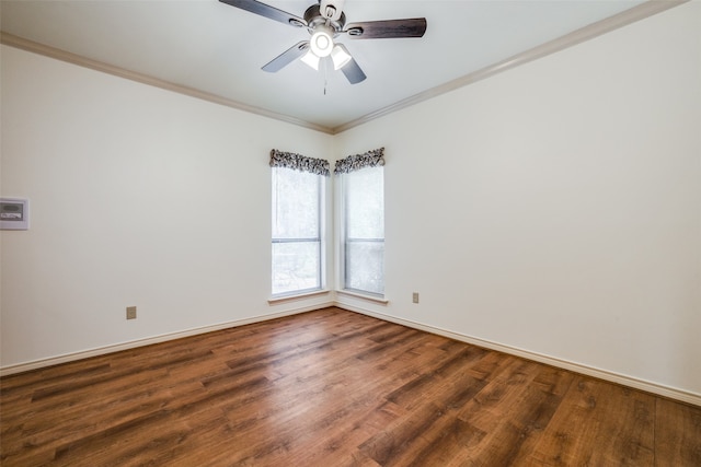 spare room with dark hardwood / wood-style flooring, ceiling fan, and crown molding