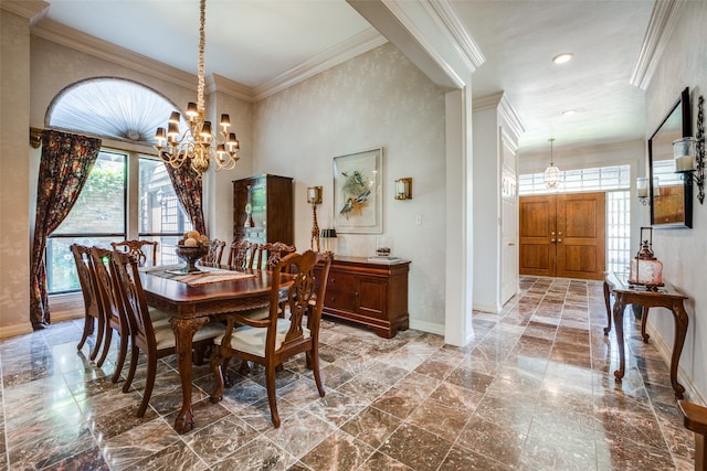 dining area with ornamental molding and a chandelier