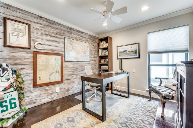 home office featuring hardwood / wood-style floors, crown molding, ceiling fan, and wooden walls