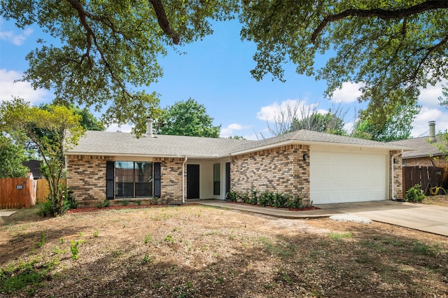 ranch-style house featuring a garage