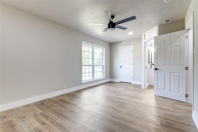 unfurnished bedroom featuring ceiling fan and light hardwood / wood-style floors