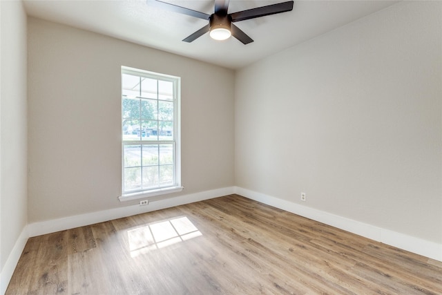 spare room with ceiling fan and light hardwood / wood-style floors