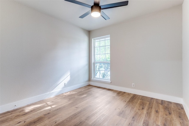 empty room featuring ceiling fan and light hardwood / wood-style floors