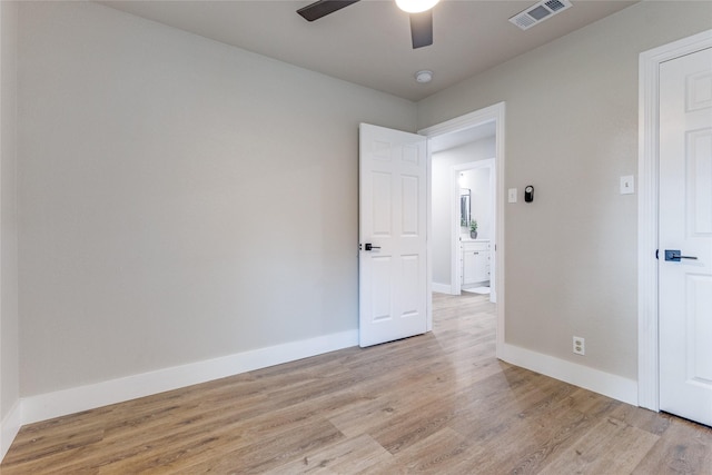 unfurnished room featuring ceiling fan and light hardwood / wood-style floors