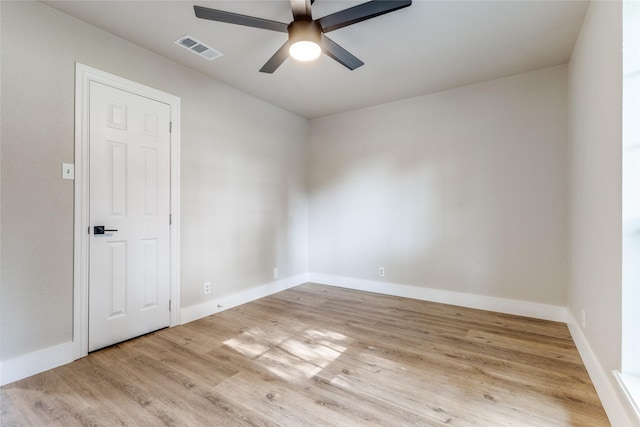 spare room featuring light hardwood / wood-style floors and ceiling fan