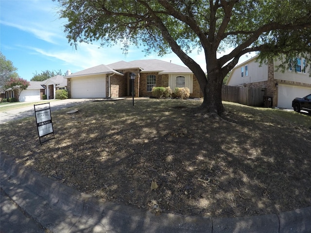 single story home featuring a garage