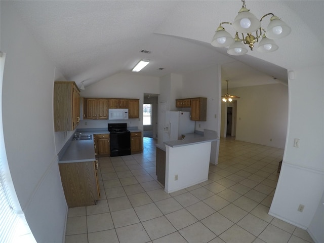 kitchen with light tile patterned floors, ceiling fan with notable chandelier, white appliances, and decorative light fixtures