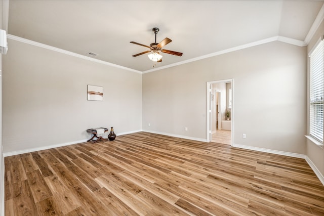 unfurnished room featuring ceiling fan, light wood-type flooring, lofted ceiling, and ornamental molding