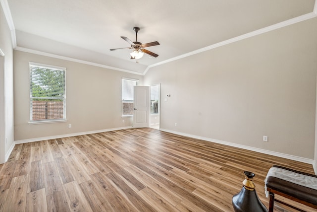 spare room featuring light hardwood / wood-style flooring, ceiling fan, and ornamental molding