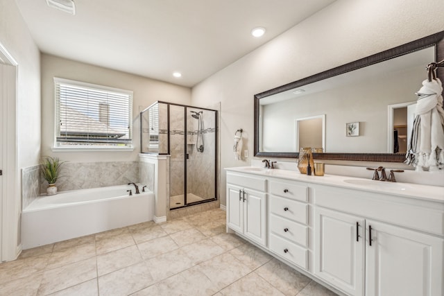 bathroom with tile patterned floors, plus walk in shower, and vanity