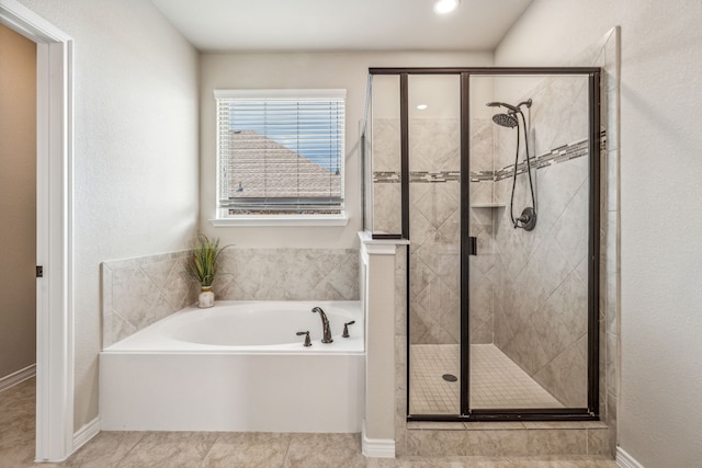 bathroom featuring independent shower and bath and tile patterned flooring