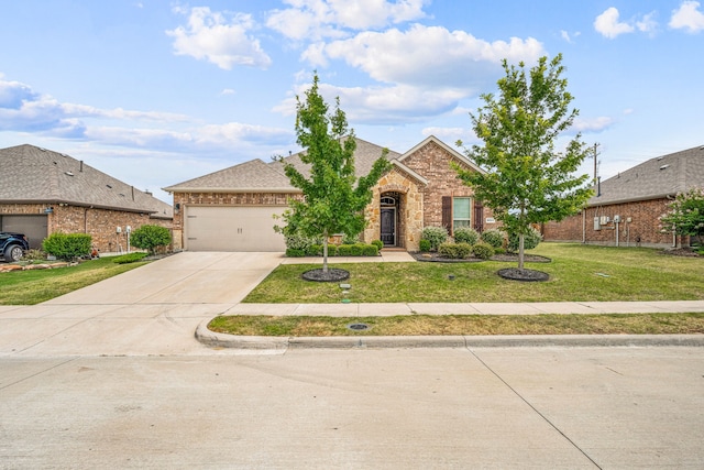 view of front of house featuring a garage and a front lawn