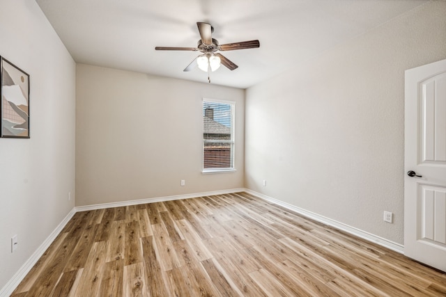 unfurnished room featuring ceiling fan and light hardwood / wood-style floors