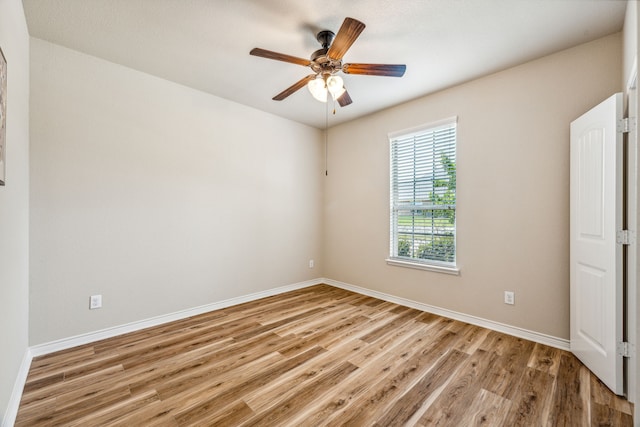 empty room featuring ceiling fan and light wood-type flooring