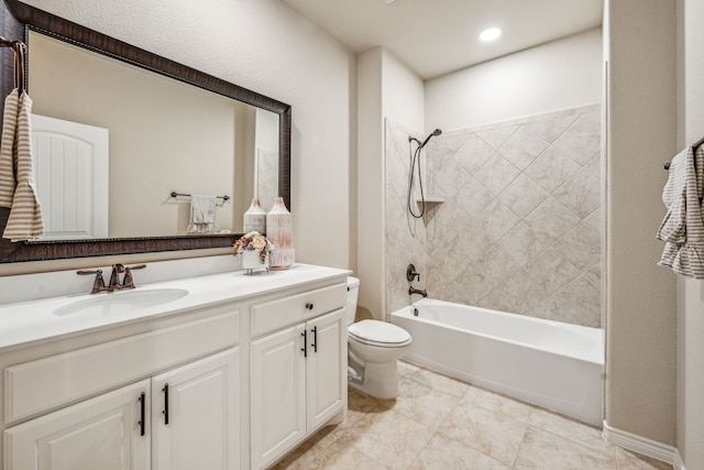 full bathroom featuring tiled shower / bath combo, tile patterned flooring, toilet, and vanity