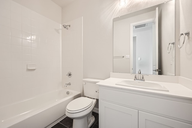 full bathroom featuring vanity, tiled shower / bath combo, toilet, and tile patterned floors