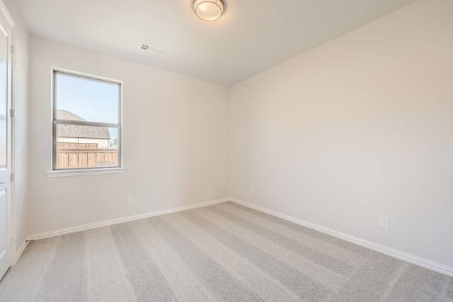 unfurnished room featuring carpet flooring